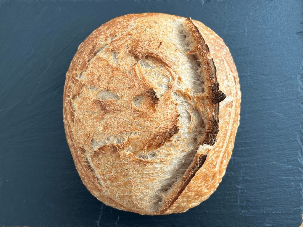 Country sourdough boule on a slate board — Loaves by Gerard