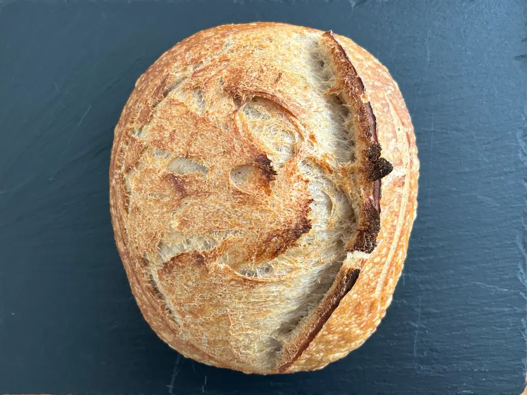 Country sourdough boule on a slate board — Loaves by Gerard
